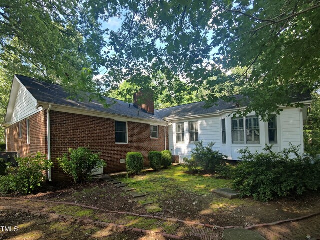 6517 Whitted Rd, Fuquay Varina, NC 27526 - view of front facade with a chimney and brick siding