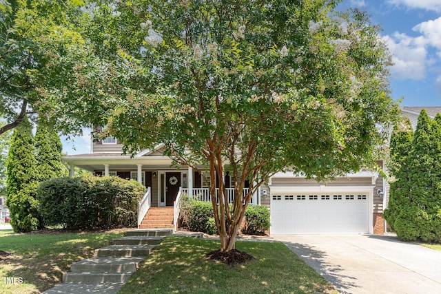 2201 Wide River Dr, Raleigh, NC 27614 - obstructed view of property featuring driveway, stairway, covered porch, brick siding, and an attached garage