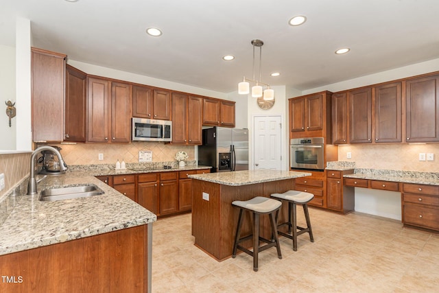 2201 Wide River Dr, Raleigh, NC 27614 - kitchen featuring stainless steel appliances, light stone countertops, a breakfast bar area, backsplash, and recessed lighting