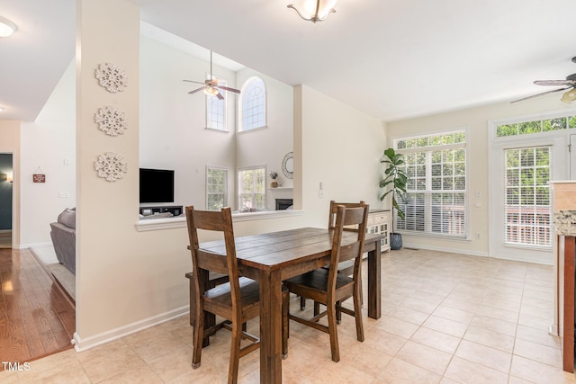 2201 Wide River Dr, Raleigh, NC 27614 - dining room with a ceiling fan, lofted ceiling, and light tile patterned floors