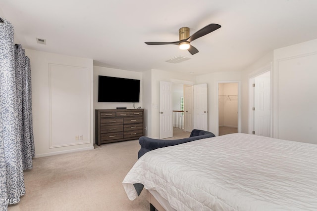 2201 Wide River Dr, Raleigh, NC 27614 - bedroom featuring light carpet, ceiling fan, and a spacious closet