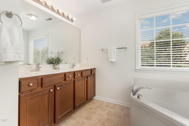 2201 Wide River Dr, Raleigh, NC 27614 - bathroom featuring double vanity, a garden tub, and tile patterned floors