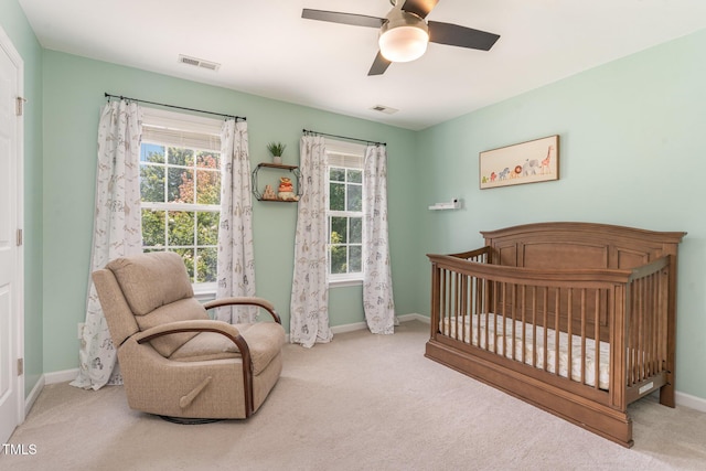 2201 Wide River Dr, Raleigh, NC 27614 - carpeted bedroom featuring a crib and a ceiling fan
