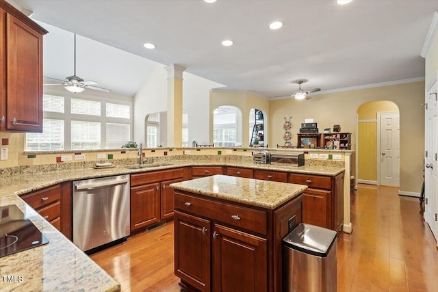 12212 Ashton Woods Ln, Raleigh, NC 27614 - kitchen featuring stainless steel dishwasher, ceiling fan, arched walkways, light stone countertops, and crown molding