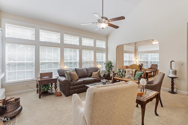 12212 Ashton Woods Ln, Raleigh, NC 27614 - carpeted living room featuring a ceiling fan, high vaulted ceiling, and healthy amount of natural light