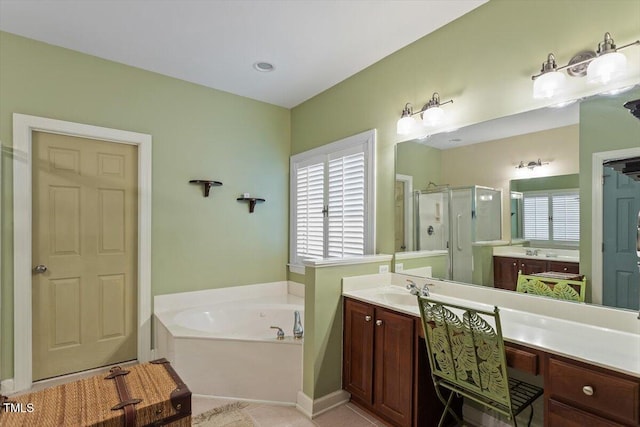 12212 Ashton Woods Ln, Raleigh, NC 27614 - bathroom with a stall shower, a bath, vanity, and tile patterned floors