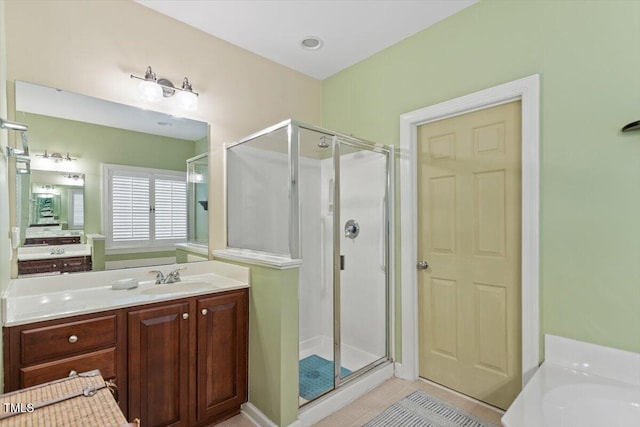 12212 Ashton Woods Ln, Raleigh, NC 27614 - full bath featuring a shower stall, vanity, tile patterned flooring, and a garden tub