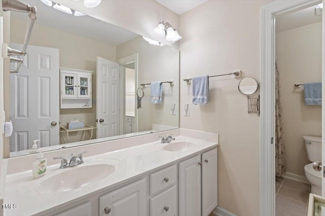 12212 Ashton Woods Ln, Raleigh, NC 27614 - bathroom with double vanity and tile patterned floors