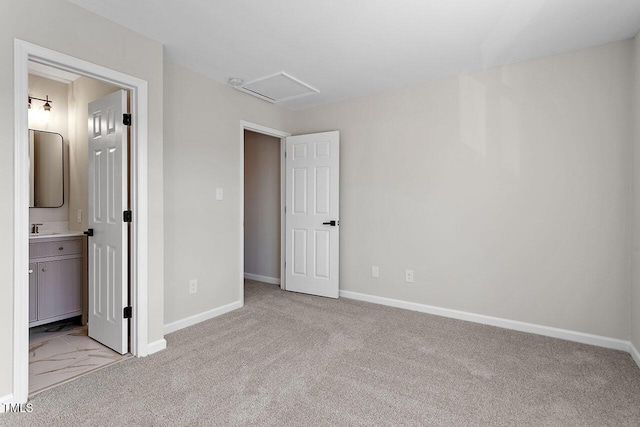 407 E Williams St, Angier, NC 27501 - unfurnished bedroom featuring light carpet, attic access, and ensuite bath