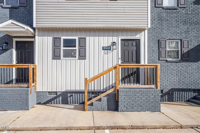 407 E Williams St, Angier, NC 27501 - view of exterior entry featuring board and batten siding and crawl space