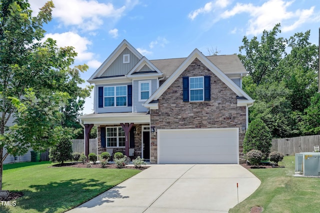 118 Tweedbank Ct, Fuquay Varina, NC 27526 - craftsman-style home with stone siding, driveway, an attached garage, board and batten siding, and covered porch