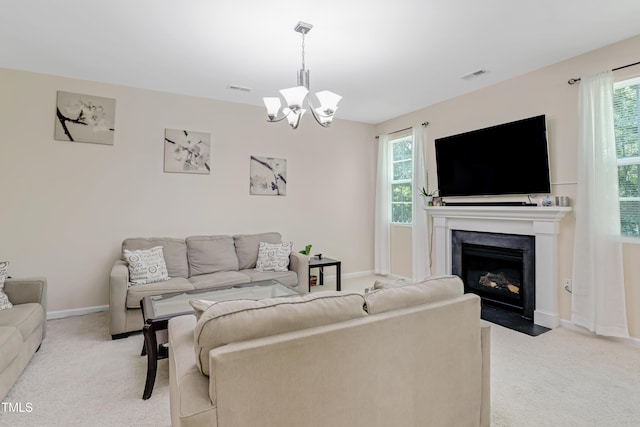 118 Tweedbank Ct, Fuquay Varina, NC 27526 - living room featuring carpet, a chandelier, healthy amount of natural light, and a fireplace with flush hearth