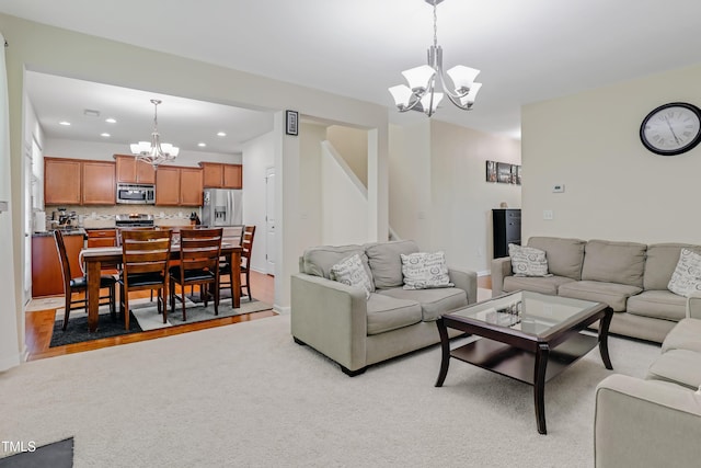 118 Tweedbank Ct, Fuquay Varina, NC 27526 - living room with a chandelier, recessed lighting, stairs, and light colored carpet