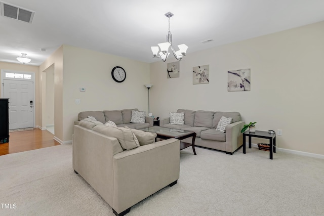 118 Tweedbank Ct, Fuquay Varina, NC 27526 - living room featuring light colored carpet and a chandelier