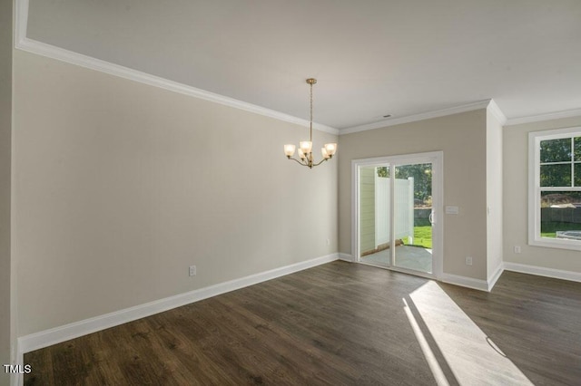 1923 Hinesley Dr, Durham, NC 27703 - unfurnished room with dark wood finished floors, a chandelier, ornamental molding, and healthy amount of natural light