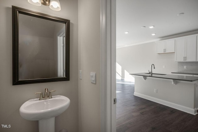 1923 Hinesley Dr, Durham, NC 27703 - bathroom with wood finished floors, ornamental molding, and recessed lighting