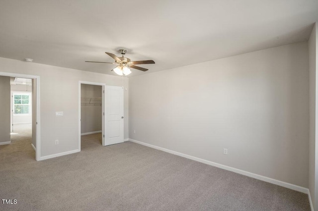 1923 Hinesley Dr, Durham, NC 27703 - unfurnished bedroom with carpet flooring, a spacious closet, a closet, and ceiling fan
