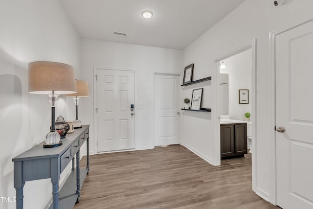 133 Ogden Pond Pl, Zebulon, NC 27597 - foyer entrance with light wood-style flooring and baseboards