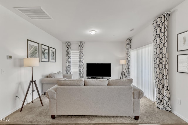 133 Ogden Pond Pl, Zebulon, NC 27597 - carpeted living room with baseboards