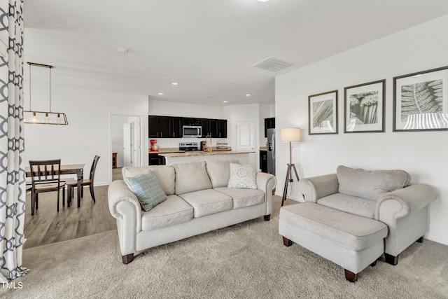 133 Ogden Pond Pl, Zebulon, NC 27597 - living area with a chandelier, recessed lighting, and light wood-style flooring