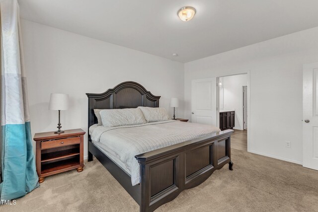 133 Ogden Pond Pl, Zebulon, NC 27597 - bedroom featuring light colored carpet and baseboards