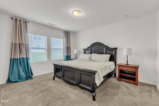133 Ogden Pond Pl, Zebulon, NC 27597 - bedroom featuring light colored carpet and baseboards