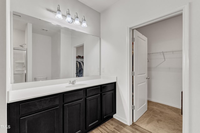 133 Ogden Pond Pl, Zebulon, NC 27597 - full bathroom featuring vanity and a walk in closet