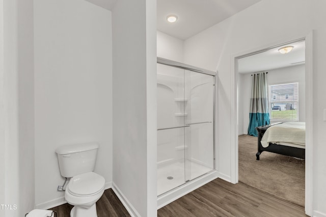133 Ogden Pond Pl, Zebulon, NC 27597 - ensuite bathroom featuring a stall shower and wood finished floors