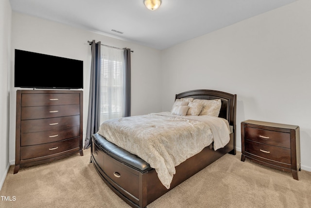 133 Ogden Pond Pl, Zebulon, NC 27597 - bedroom featuring light colored carpet and baseboards