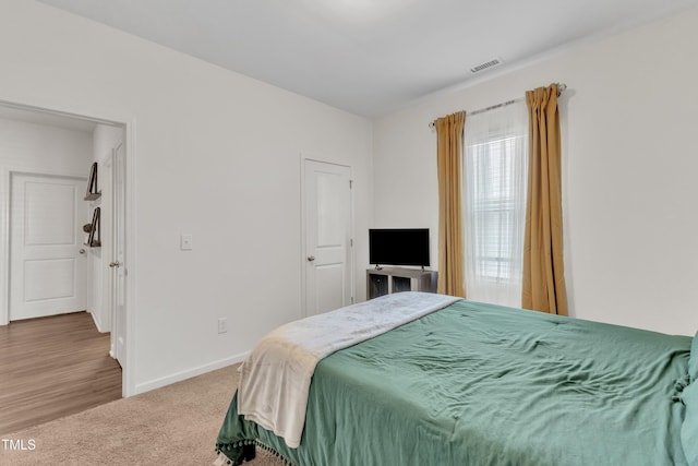 133 Ogden Pond Pl, Zebulon, NC 27597 - carpeted bedroom featuring baseboards
