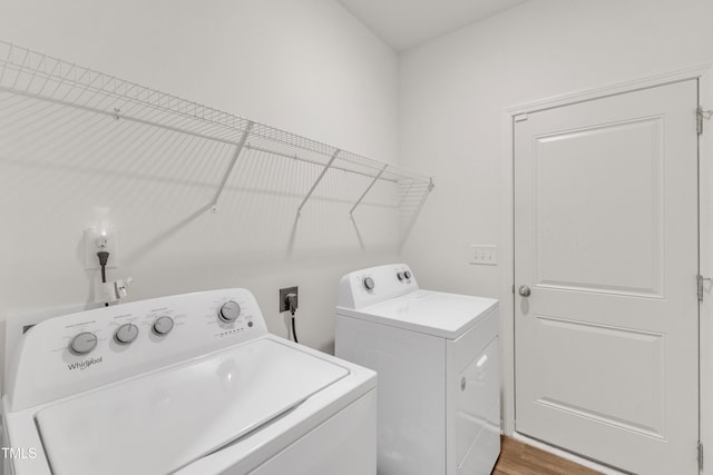 133 Ogden Pond Pl, Zebulon, NC 27597 - laundry room featuring washer and dryer and wood finished floors