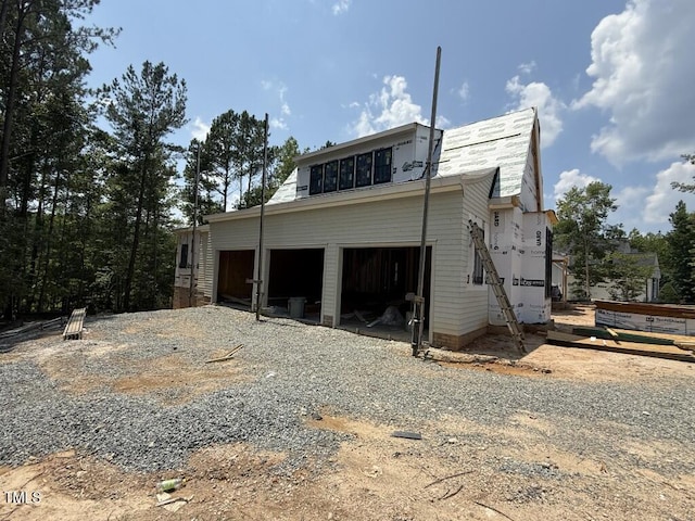1513 Rock Dove Way, Raleigh, NC 27614 - view of side of home featuring gravel driveway and an attached garage