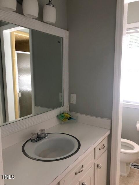 5018 Gatewood Dr, Durham, NC 27712 - bathroom with plenty of natural light and vanity