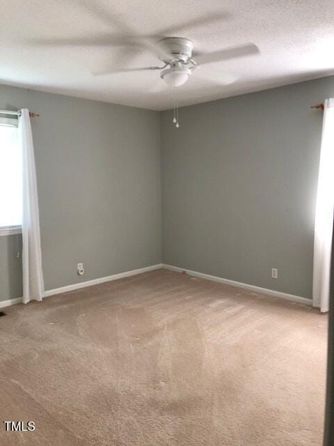 5018 Gatewood Dr, Durham, NC 27712 - spare room featuring ceiling fan, carpet, and a textured ceiling