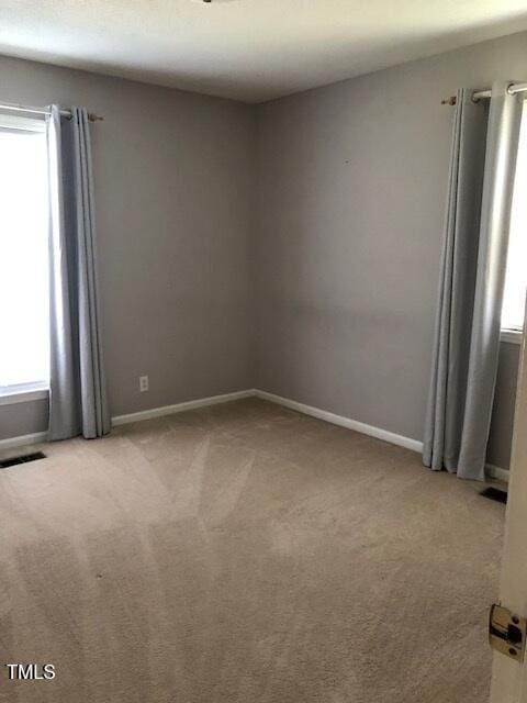 5018 Gatewood Dr, Durham, NC 27712 - spare room with light carpet