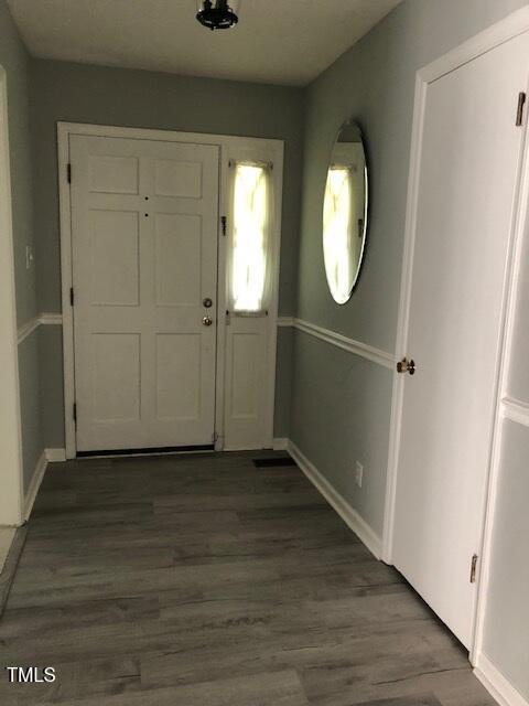 5018 Gatewood Dr, Durham, NC 27712 - foyer featuring wood finished floors