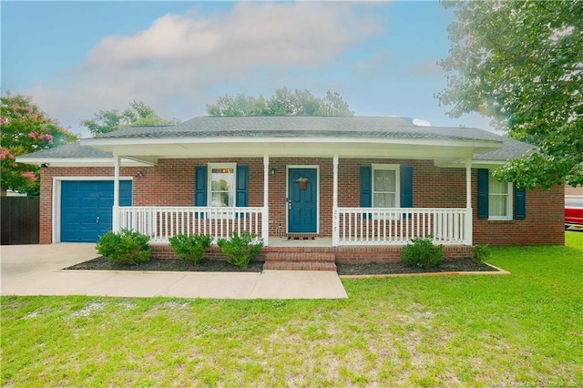 2517 Previs Rd, Fayetteville, NC 28306 - single story home featuring a porch, a garage, driveway, and brick siding