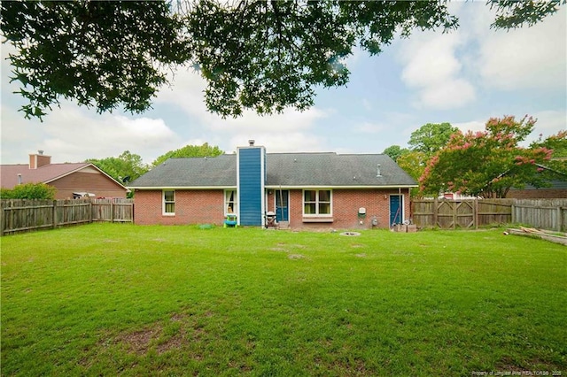 2517 Previs Rd, Fayetteville, NC 28306 - back of house featuring a chimney, a fenced backyard, and brick siding