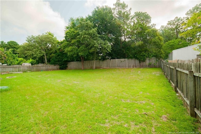2517 Previs Rd, Fayetteville, NC 28306 - fenced backyard featuring view of scattered trees