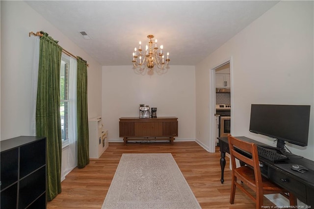 2517 Previs Rd, Fayetteville, NC 28306 - foyer entrance with light wood-style floors and a chandelier