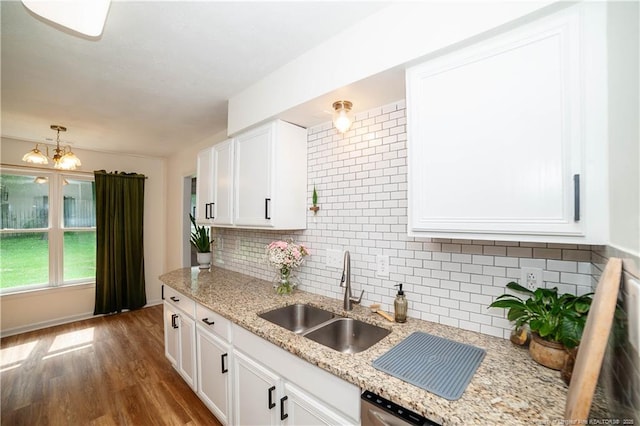 2517 Previs Rd, Fayetteville, NC 28306 - kitchen featuring tasteful backsplash, white cabinets, dark wood-type flooring, and a chandelier
