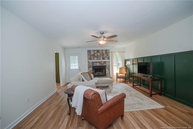2517 Previs Rd, Fayetteville, NC 28306 - living area featuring ceiling fan, a fireplace, and light wood finished floors
