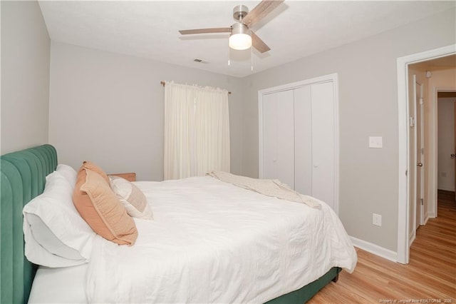 2517 Previs Rd, Fayetteville, NC 28306 - bedroom with light wood-style flooring, a closet, and a ceiling fan