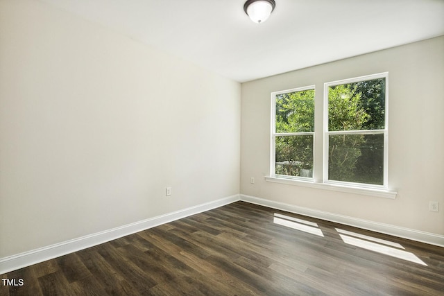 261 Begen St, Morrisville, NC 27560 - unfurnished room featuring baseboards and dark wood-type flooring