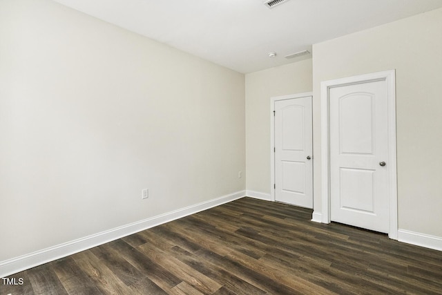 261 Begen St, Morrisville, NC 27560 - unfurnished bedroom featuring dark wood finished floors and baseboards