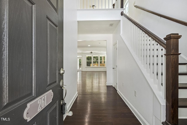 261 Begen St, Morrisville, NC 27560 - foyer featuring dark wood-type flooring, stairs, and ceiling fan