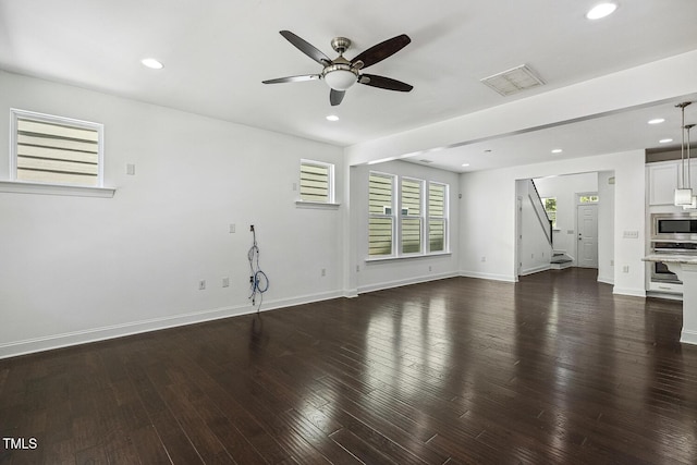 261 Begen St, Morrisville, NC 27560 - unfurnished living room featuring ceiling fan, stairs, recessed lighting, and dark wood-style floors