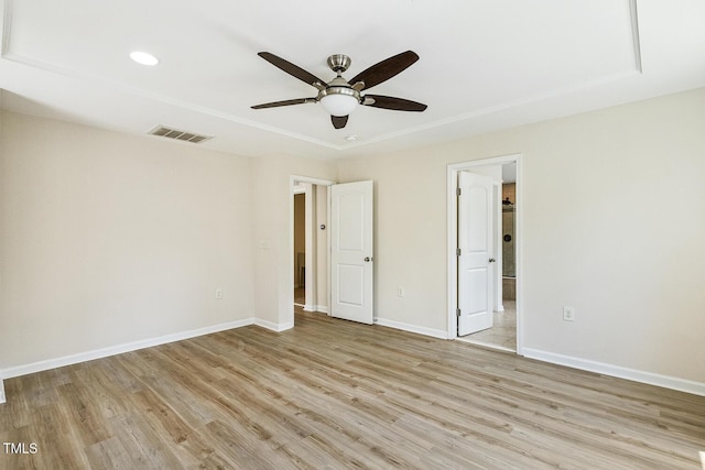 261 Begen St, Morrisville, NC 27560 - unfurnished bedroom featuring light wood-type flooring, recessed lighting, ensuite bathroom, and ceiling fan