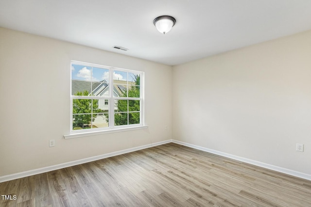 261 Begen St, Morrisville, NC 27560 - spare room featuring wood finished floors and baseboards