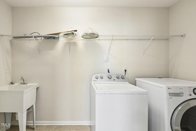 261 Begen St, Morrisville, NC 27560 - washroom featuring separate washer and dryer and light tile patterned floors